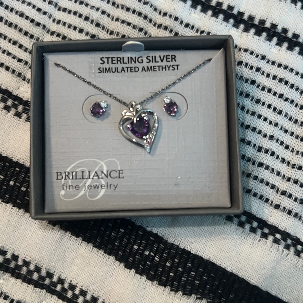 Sterling silver necklace and earring set with amethyst stones.